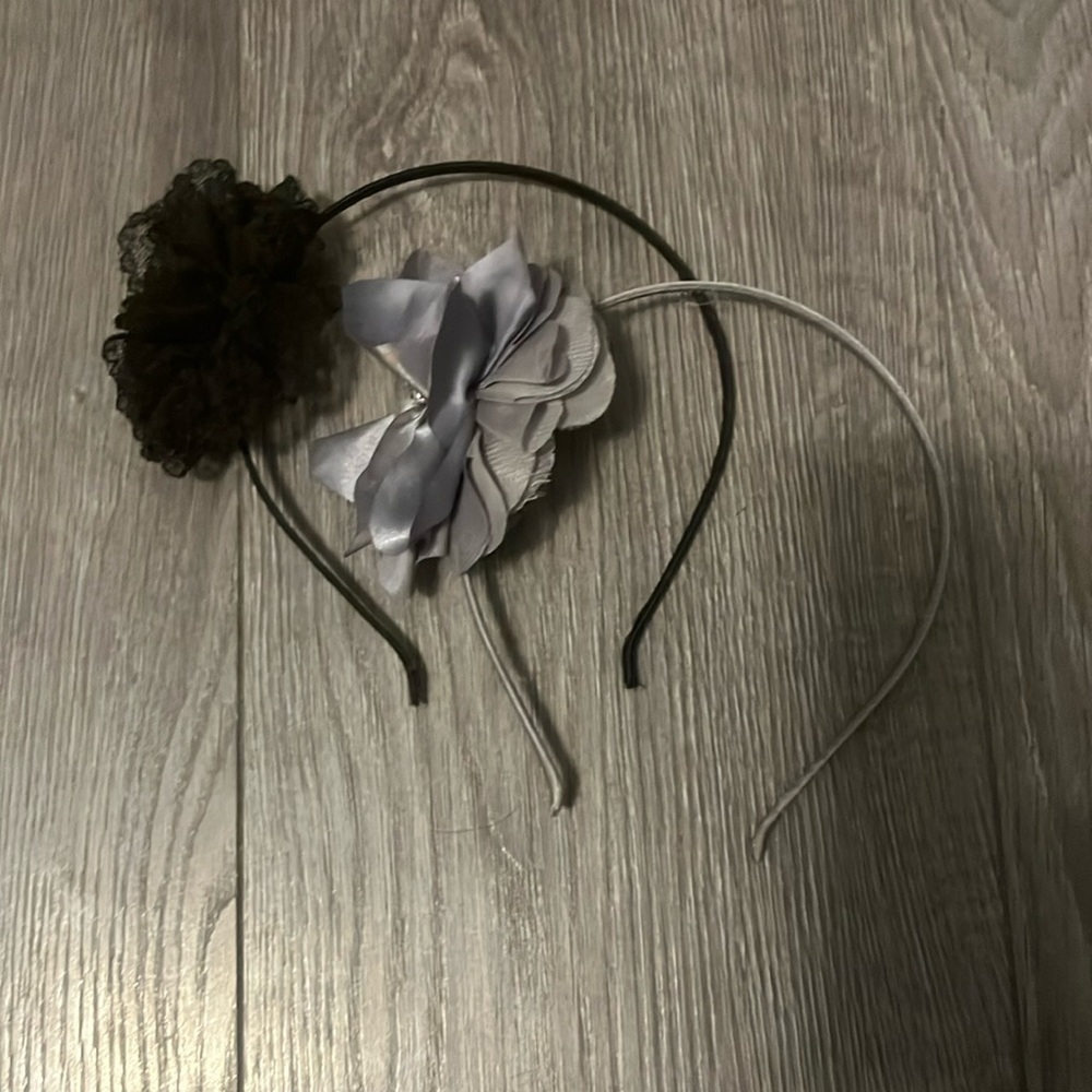 Black lacy and silver satin flower headbands with gem embellishment